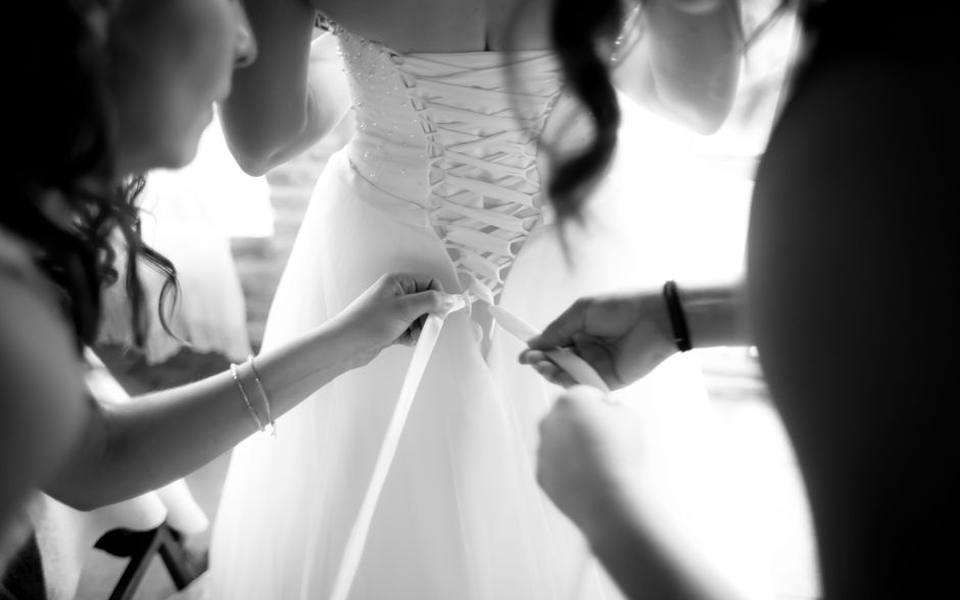 Getting a gown ready for a new owner